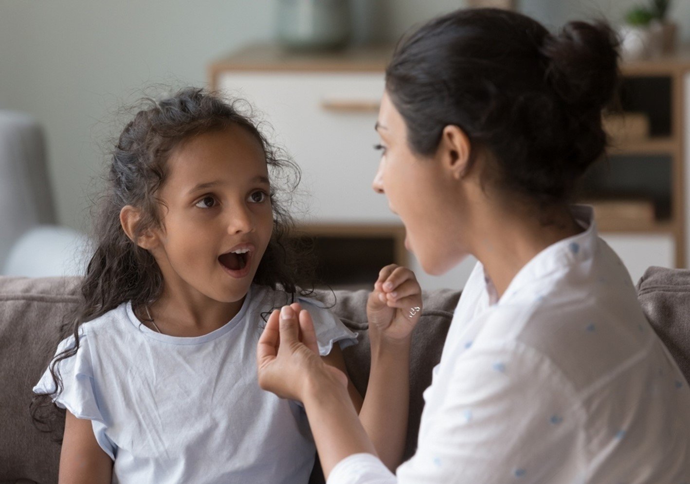 Therapist guiding child